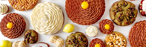 Brown, green, yellow and beige cakes by Cedric Grolet