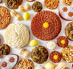 Brown, green, yellow and beige cakes by Cedric Grolet