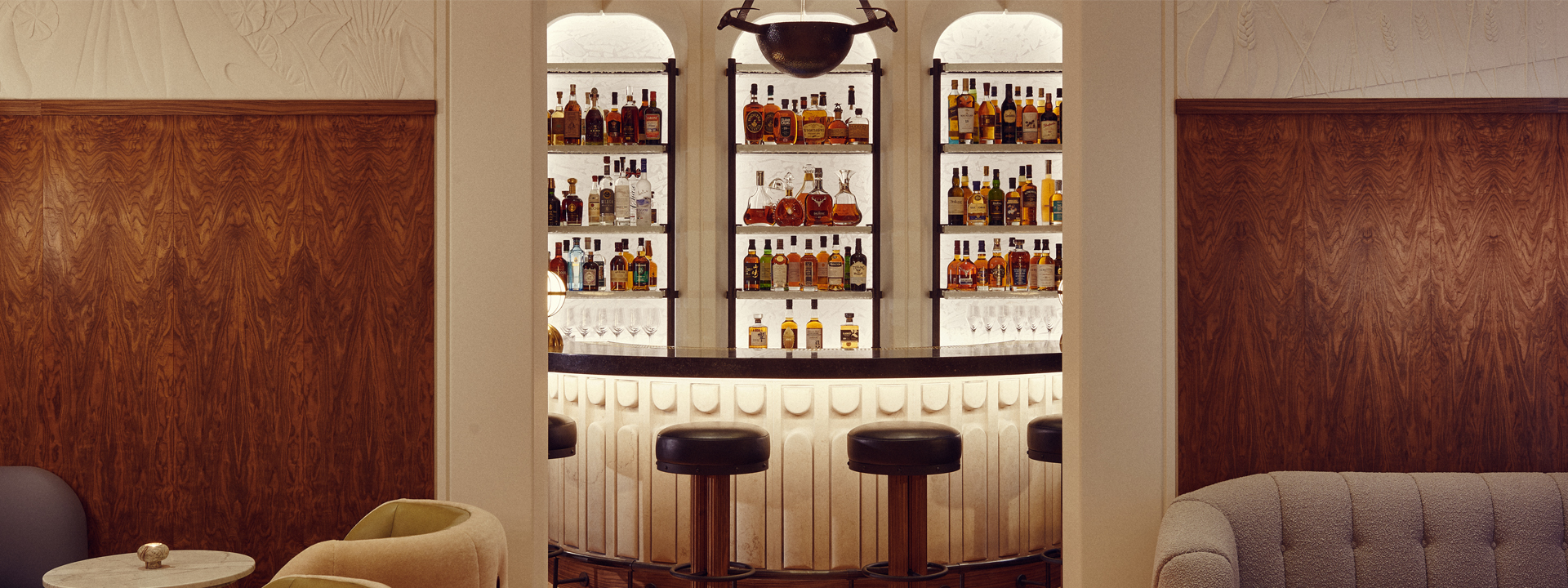 The Berkeley Bar & Terrace interior with leather stools around the bar at The Berkeley